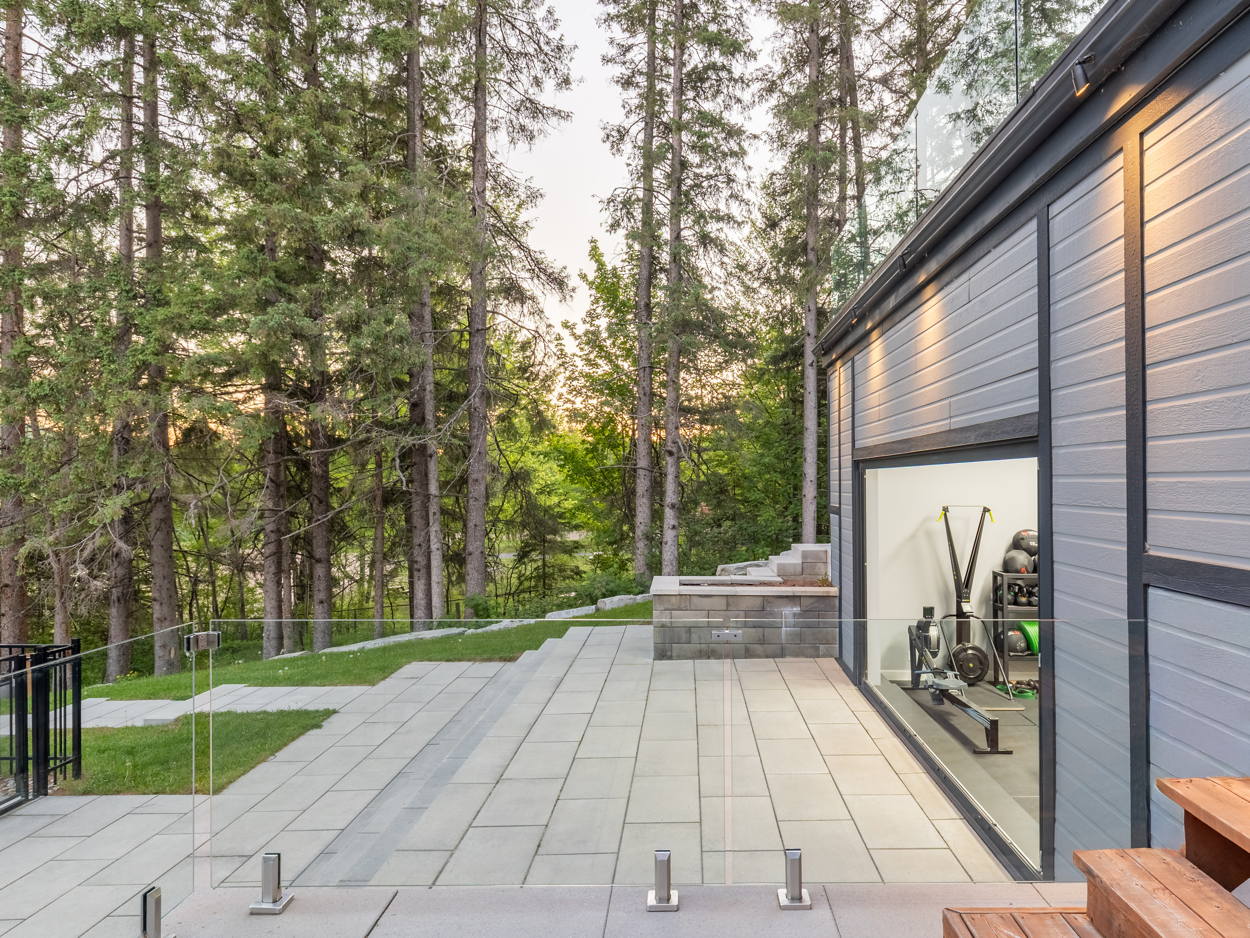 Lakeside transformation property surrounded by trees